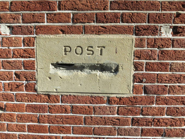 istock post mortem, post box or mailbox stopped up with cement in a red brick wall 1150977944