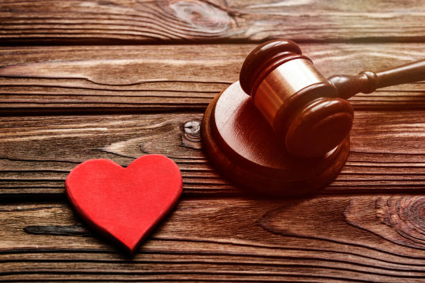 istock Heart, the judge's gavel on wooden background. 1150978577