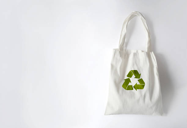 istock White cloth bag with recycled symbol, isolated on a white background 1150979325