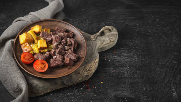 istock Baked beef with croutons, cherry tomatoes 1150981095