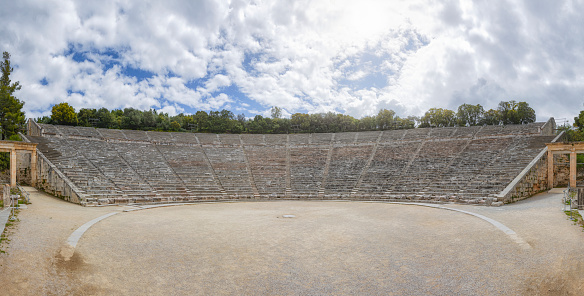The Ancient Theatre of Epidaurus is a theatre in the Greek city of Epidaurus, located on the southeast end of the sanctuary dedicated to the ancient Greek God of medicine, Asclepius. It is built on the west side of Cynortion Mountain, near modern Lygourio, and belongs to the Epidaurus Municipality. It is considered to be the most perfect ancient Greek theatre with regard to acoustics and aesthetics.