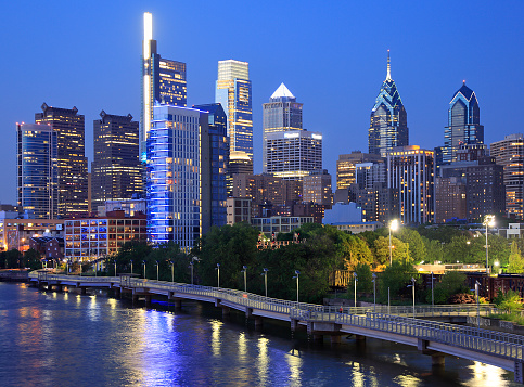 Philadelphia skyline at night with the Schuylkill River on the foreground, USA