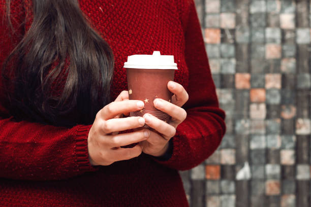 istock closeup young woman drinking coffee 1150983893