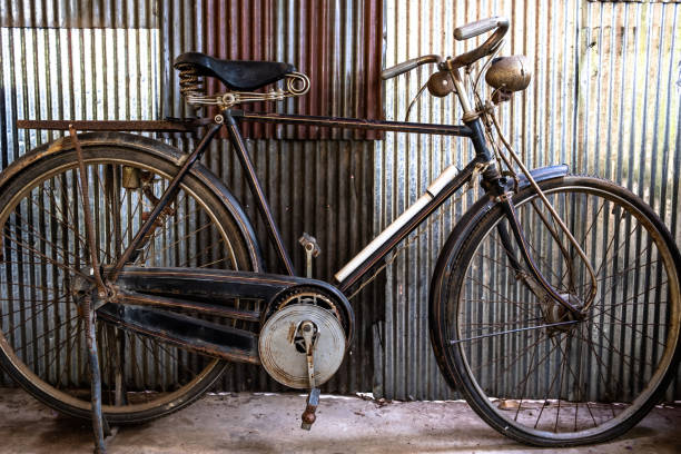istock A vintage bicycle parking in front of rusty corrugated galvanized iron wall. 1150985130