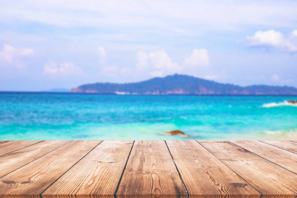 istock Wood table and beautiful sea with sand beach 1150989288
