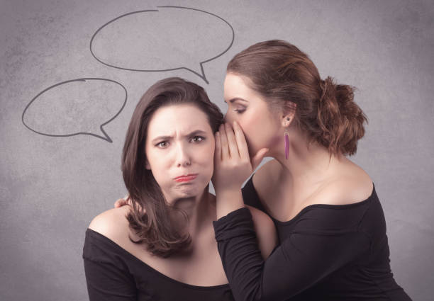 istock girl telling secret things to her girlfriend 1150992876