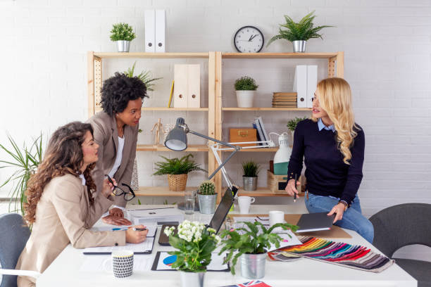 istock Three multiethnic woman working at the office and discuss about job 1150993123