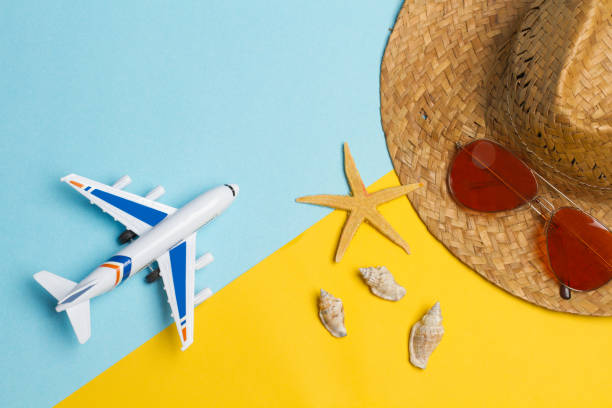 istock A toy plane on a yellow and light blue background 1150993528
