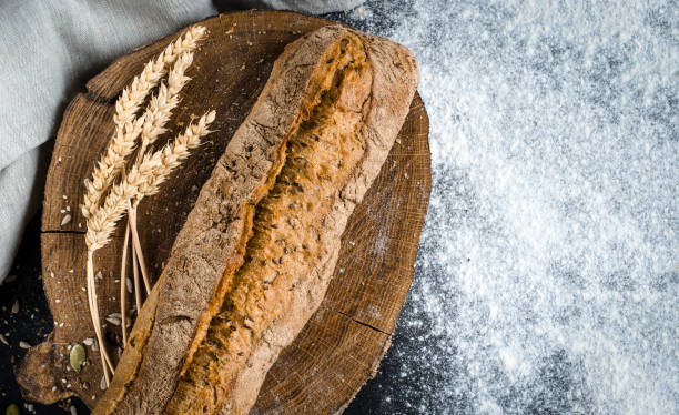 istock Freshly baked homemade traditional bread on rustic wooden table 1150994639