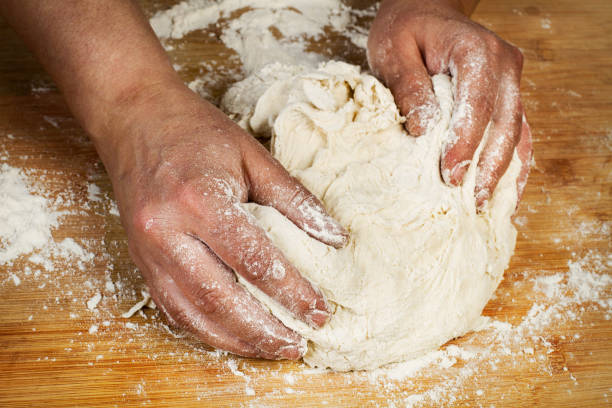 istock Woman kneading a dough 1150994670