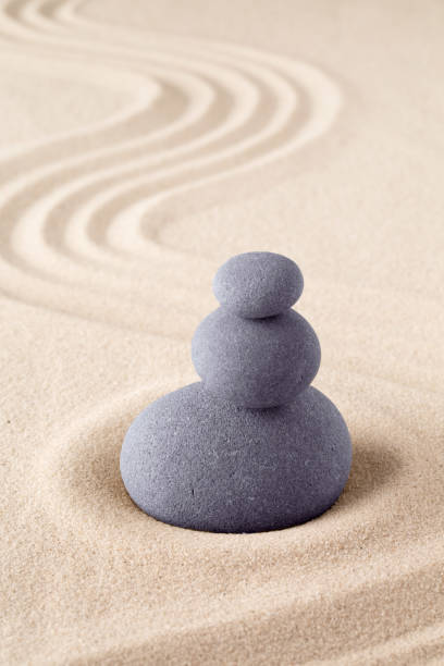 istock Stone stack, Japanese zen sand garden with pile of rocks 1150995119