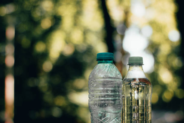 istock Closeup shot of two plastic bottles with a natural background 1150998562