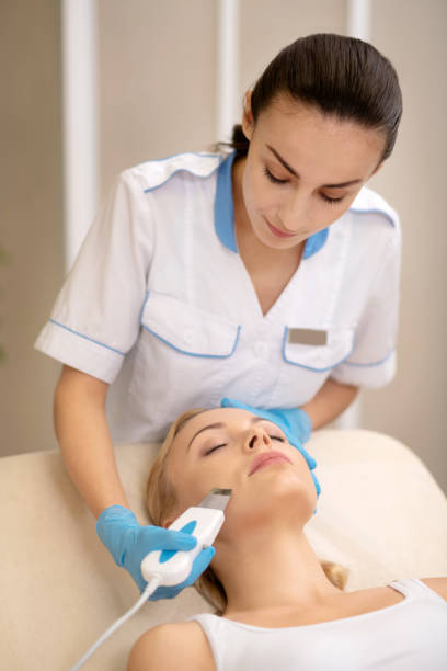 istock Cosmetologist feeling busy while cleansing face skin 1150999231