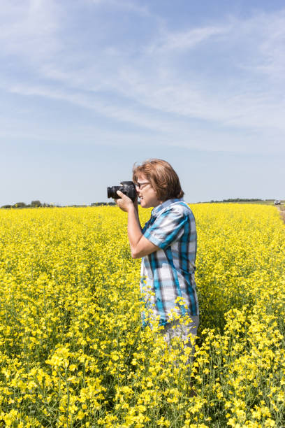 istock woman in a canola field 1151000567