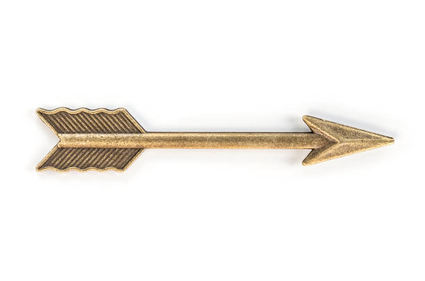 Brass arrow on white background. Clipping path. stock photo