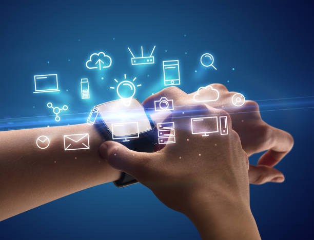 istock Hand wearing smartwatch with multimedia symbols 1151001787