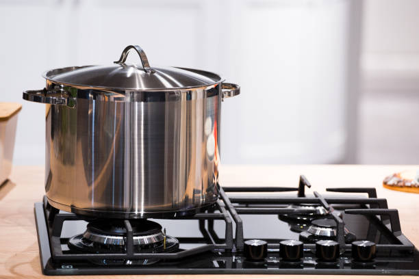 istock chrome pan on the gas cooking plate 1151002589
