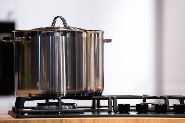 istock chrome pan on the gas cooking plate 1151002607