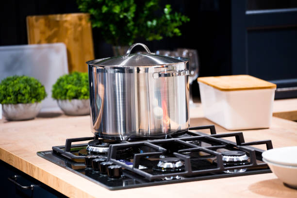 istock chrome pan on the gas cooking plate 1151002647
