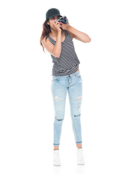 istock Female photographer holding a camera 1151002754