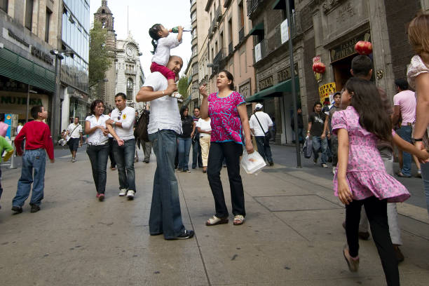 People walk on Madero Street stock photo