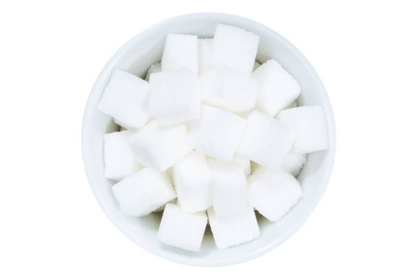 istock Lump sugar from above bowl isolated on white 1151006329