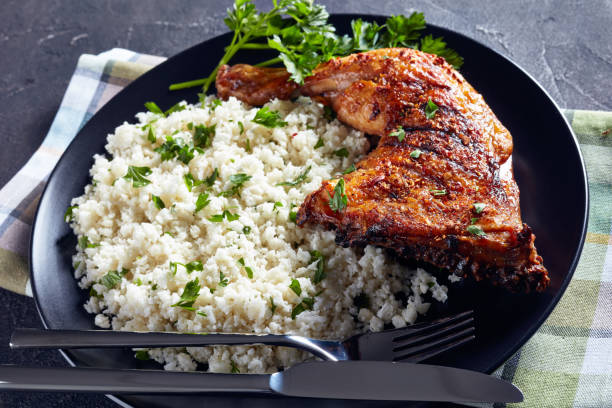istock grilled chicken leg quarter served with Cauliflower rice or couscous 1151006513