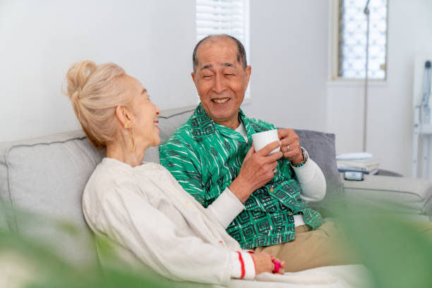 istock Senior couple relaxing at home on the sofa 1151006765