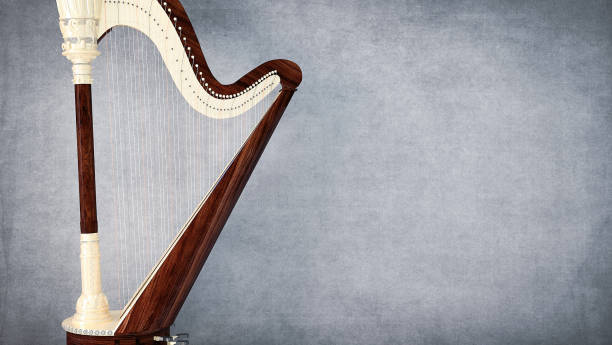 instrument de musique de harpe sur le fond gris - blues harp photos et images de collection