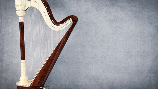 Harp music instrument on gray background
