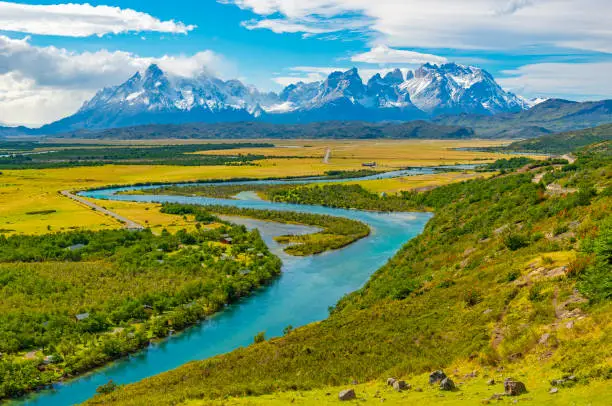 Majestic landscape of the Torres del Paine national park with the Cuernos del Paine peaks and the Serrano river near Puerto Natales, Patagonia, Chile.