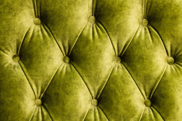 istock Velor lime surface of sofa close-up 1151008443