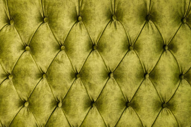 istock Velor lime surface of sofa close-up 1151008454