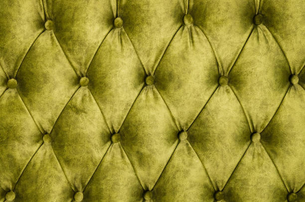 istock Velor lime surface of sofa close-up 1151008486