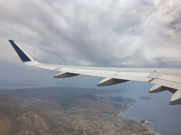 istock Aeroplane wing shot through aircraft window 1151008498