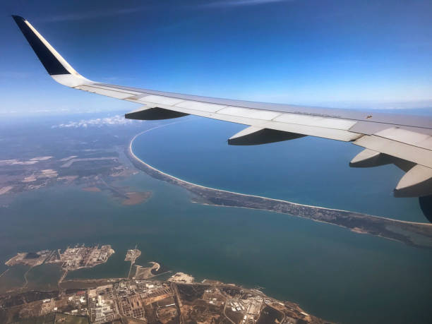 istock Aeroplane wing shot through aircraft window 1151008585