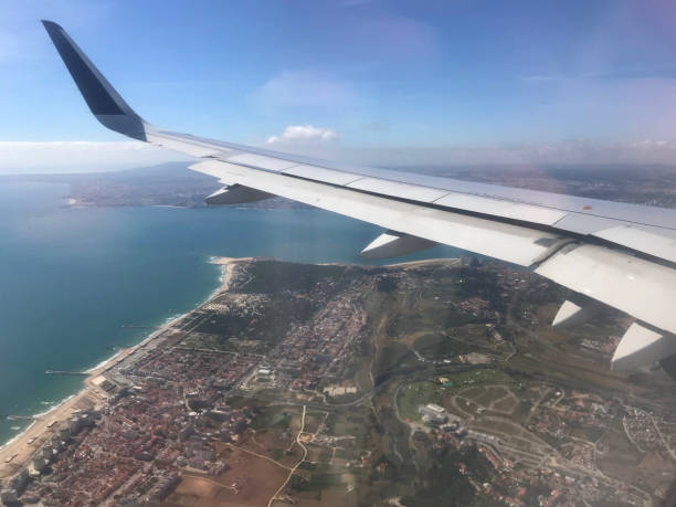 istock Aeroplane wing shot through aircraft window 1151008603