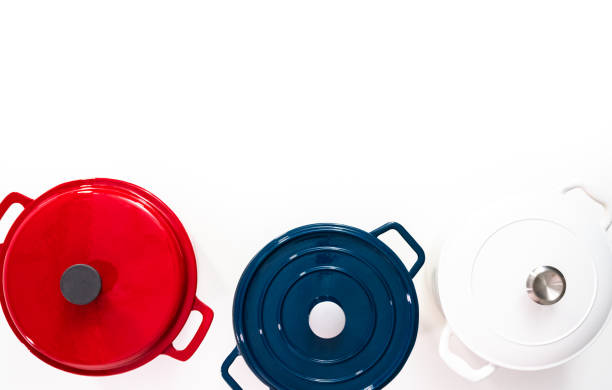 istock Red, white and blue enameled cast iron covered round dutch ovens on 1151011378