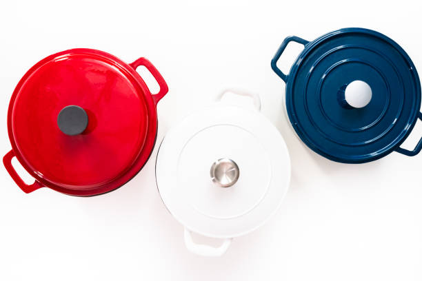 istock Red, white and blue enameled cast iron covered round dutch ovens on 1151011417