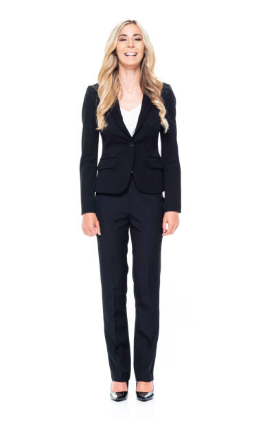 attractive blond businesswoman - hands by side - arms at side imagens e fotografias de stock