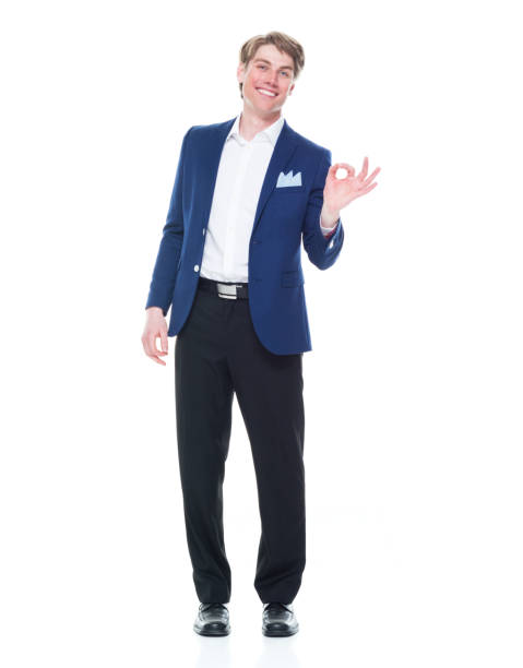 istock Handsome man holding a question mark sign and wearing a blue blazer 1151016165