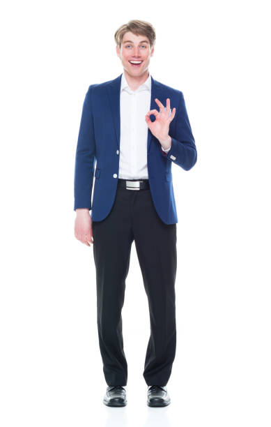 istock Handsome man holding a question mark sign and wearing a blue blazer 1151016198