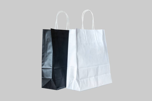 istock Two paper shopping bags isolated on grey background 1151017064