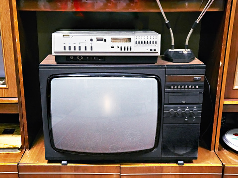 Old analog TV and VCR in interior