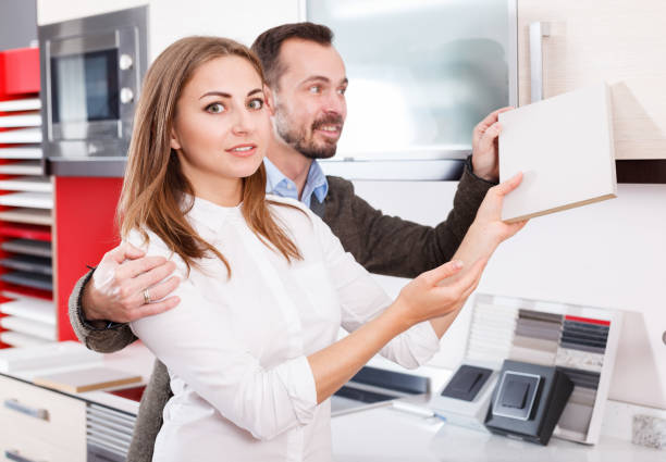 istock Couple choosing kitchen furniture materials 1151021514