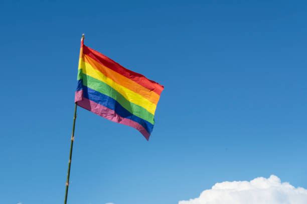 istock Rainbow flag with blue sky. LGBTQ 1151021767