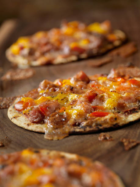 istock Small Tortilla Pizzas with Sausage and Peppers 1151022593