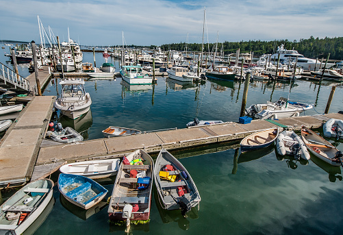 Boats of many types large and small gather at a marina in southeast Maine.