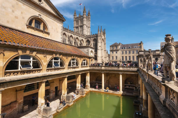 inside of Roman Baths which is a site of historical interest in the city of Bath. The landmark is a well-preserved Roman site for public bathing Bath, England - May 13, 2019 : inside of Roman Baths which is a site of historical interest in the city of Bath. The landmark is a well-preserved Roman site for public bathing . bath england photos stock pictures, royalty-free photos & images