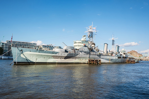 London, UK - May 12, 2019: HMS BELFAST a museum ship moored near tower bridge on the river Thames. A Town class light cruiser built for the Royal Navy in the 1930's which saw action in WWII.
